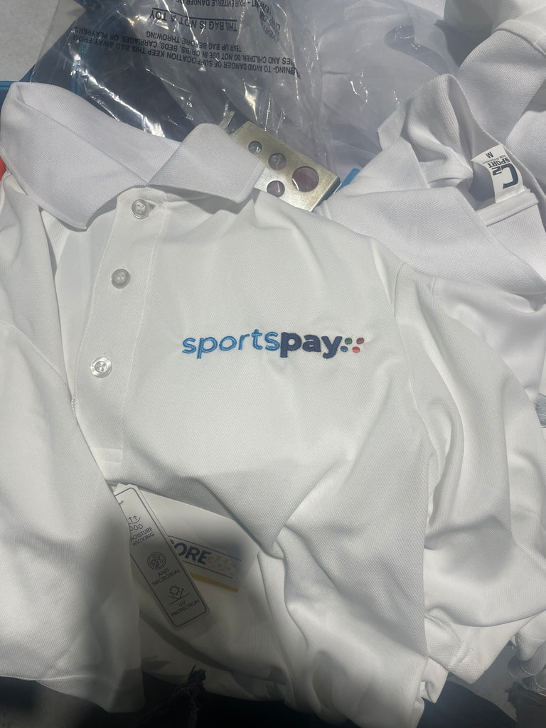 SportsPay embroidered on a white polyester collared shirt with green brown orange and blue dots arranged in a square 