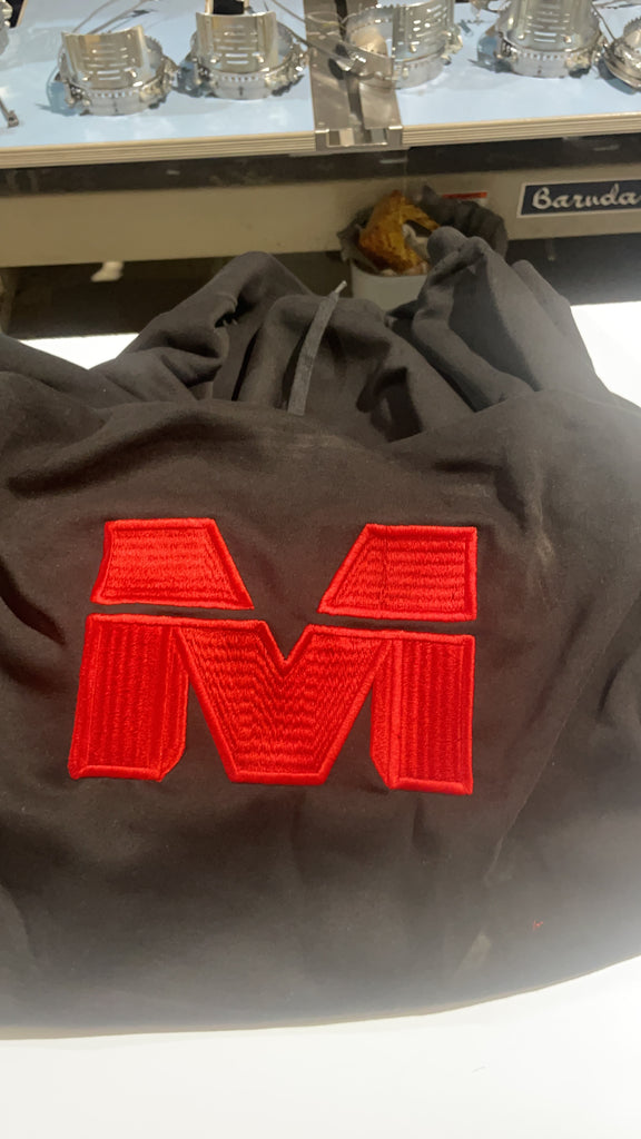 A red embroidered M for the Movement on shaka wear #Megasean 