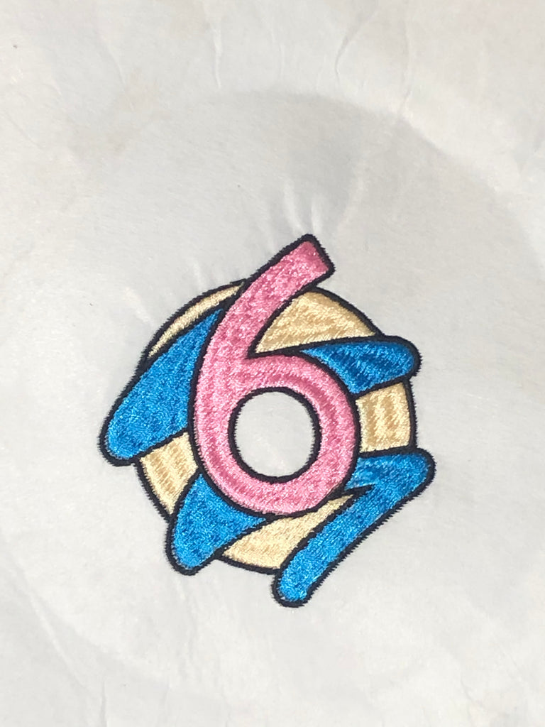 An embroidered Donut with swirls for 6 Donuts, a prominent bakery in Toronto 