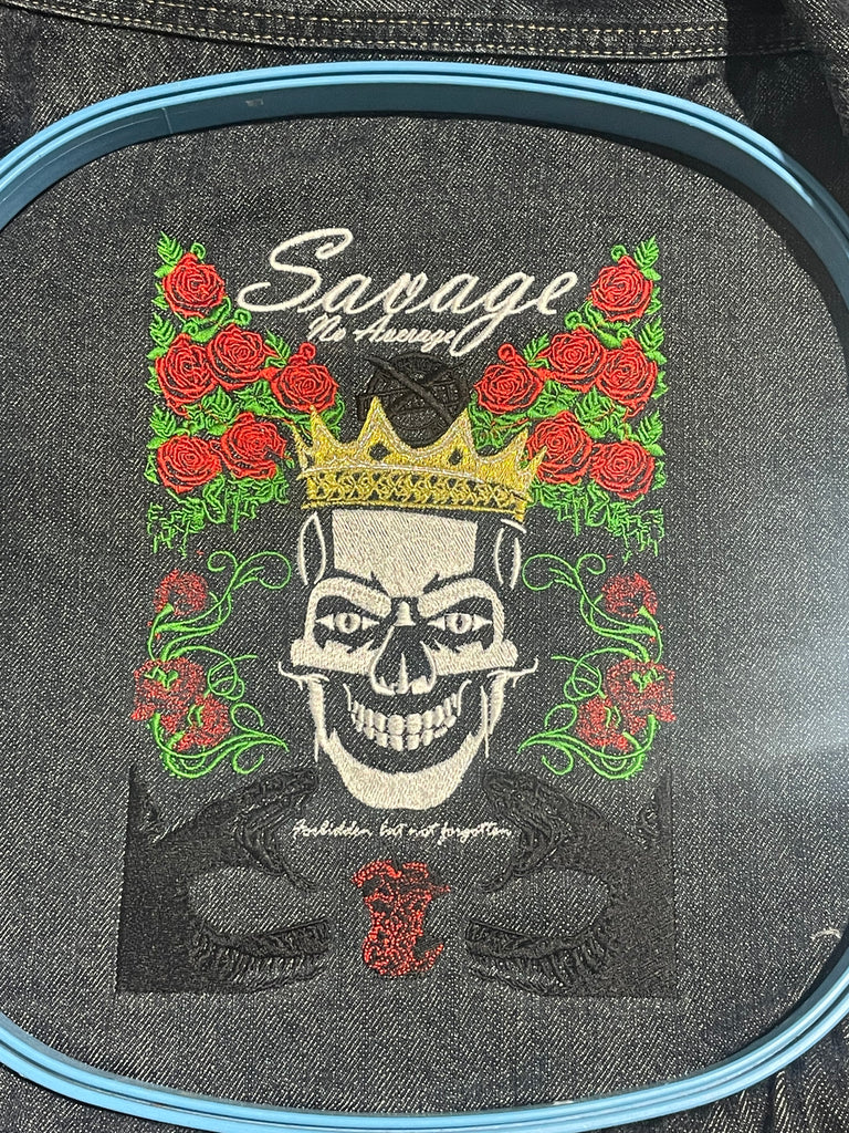Crowned Skull surrounded by roses, adorned by two snakes underneath, all completely machine embroidered