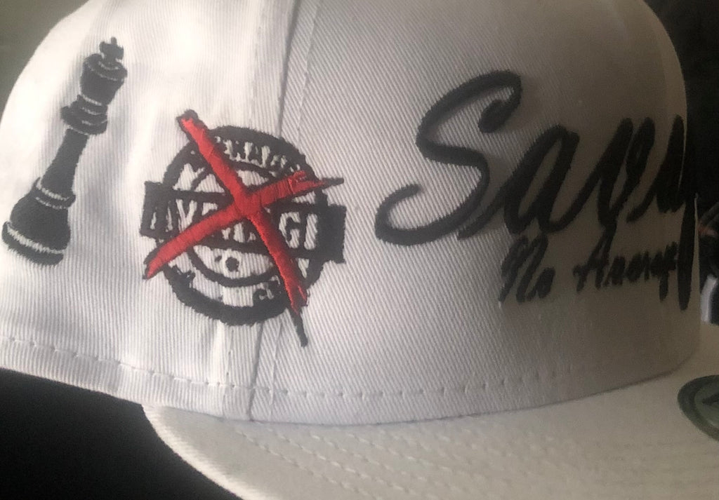 Savage No Average Puff Embroidery on new era cap, with side panel embroidery of X average badge and a King Chess piece also embroidered